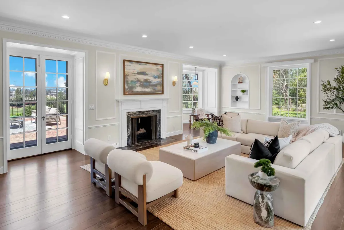 Warm contemporary living room remodel with sculptural furnishings