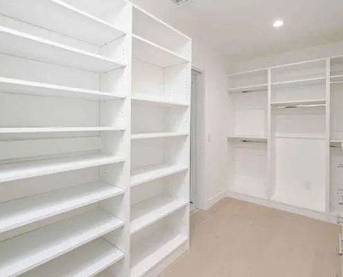The pantry really maximizes the vertical space with adjustable shelving and L-shaped shelves in the corner so there is no wasted space. The left shelves are shallow because we had a limited space there to the door, but this is the advantage to custom built shelving in the pantry