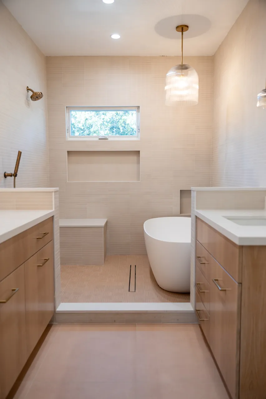 Roosevelt bathroom with textured tile and a freestanding tub